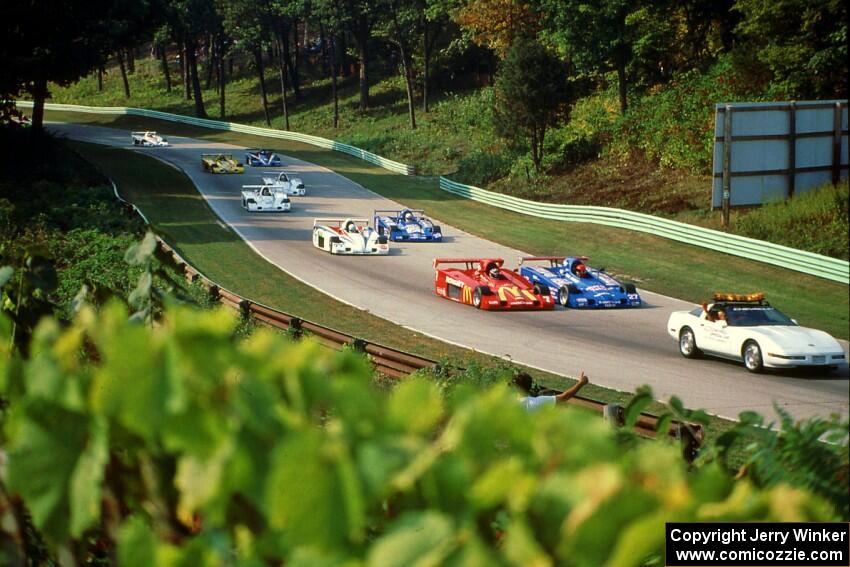 The Shelby Can-Am field comes uphill into turn 13 on the pace lap.