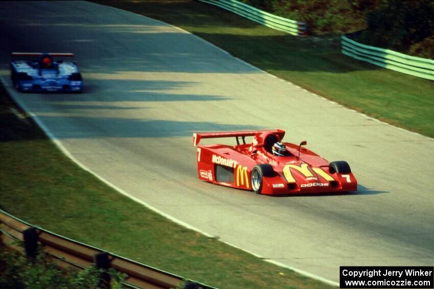 The Shelby Can-Am cars of Scott Harrington and Mike Davies battle for the lead.