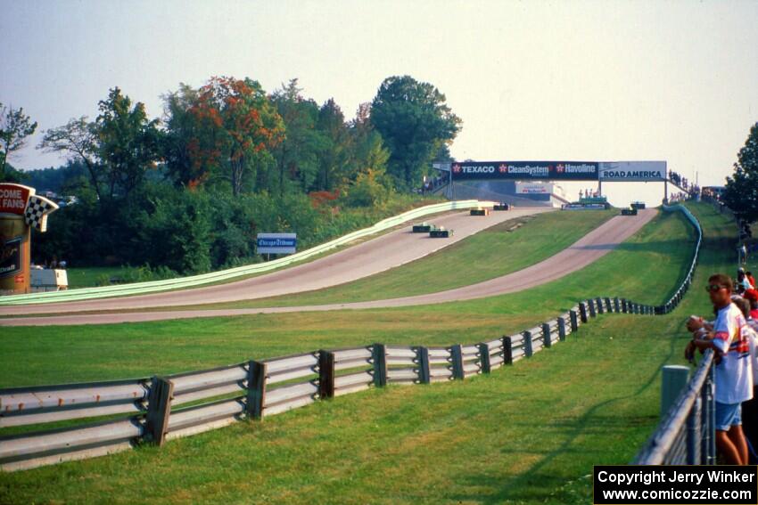 The Shelby Can-Am cars of Robert Urich and Bob Gardner head into the pits after completing just eight laps.