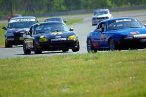 Gordon Kuhnley's Spec Miata Mazda Miata, Greg Youngdahl's Spec Miata Mazda Miata and Tom Daly's STU VW Rabbit