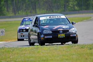 Tom Daly's STU VW Rabbit and Mike Campbell's ITA BMW 325is