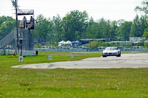 Bill Collins' T1 Chevy Corvette takes the checkered flag.