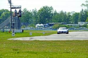 Bill Collins' T1 Chevy Corvette takes the checkered flag.