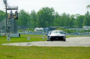 Tom Fuehrer's ITE-1 Ford Mustang and Mike Campbell's ITA BMW 325is take the checkered flag.