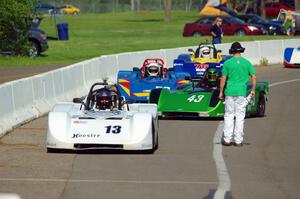 Four Spec Racer Fords line up on the false grid for the final race of the day.