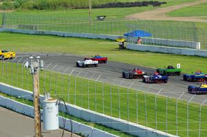 The field comes into turn 12 on the pace lap.