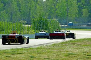 Spec Racer Fords head downhill into turns 7 and 8.