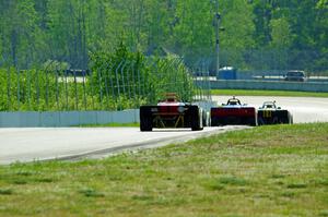 Spec Racer Fords head downhill into turns 7 and 8.