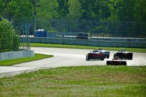 Spec Racer Fords head downhill into turns 7 and 8.