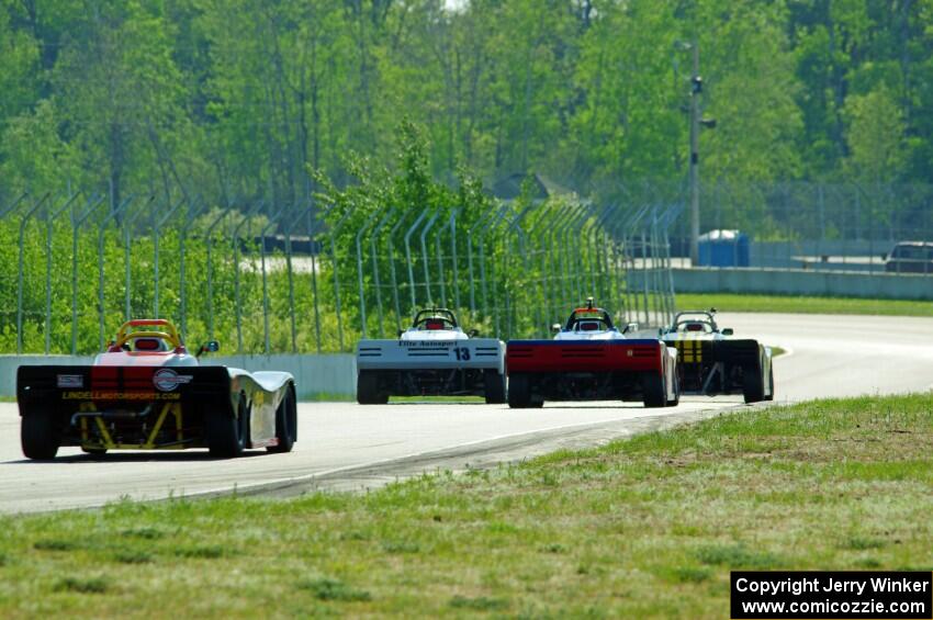 Spec Racer Fords head downhill into turns 7 and 8.