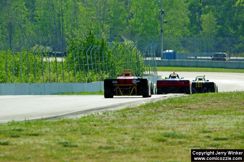 Spec Racer Fords head downhill into turns 7 and 8.