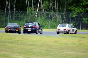 Jimmy Griggs' H Production VW Rabbit, Tom Daly's T4 VW Rabbit and Greg Youngdahl's Spec Miata Mazda Miata