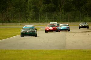 Mark Utecht's STL Honda Civic, along with Andrew Jenkins', Rick Buan's and Gordon Kuhnley's Spec Miata Mazda Miatas