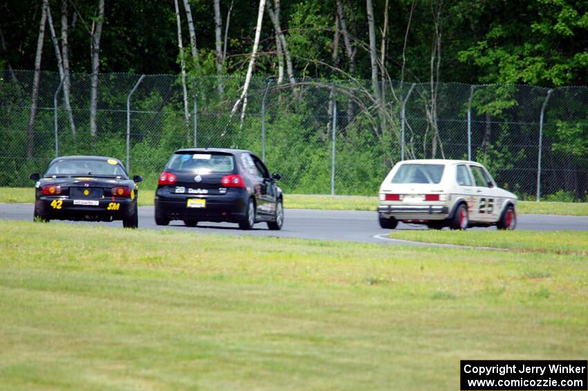 Jimmy Griggs' H Production VW Rabbit, Tom Daly's T4 VW Rabbit and Greg Youngdahl's Spec Miata Mazda Miata