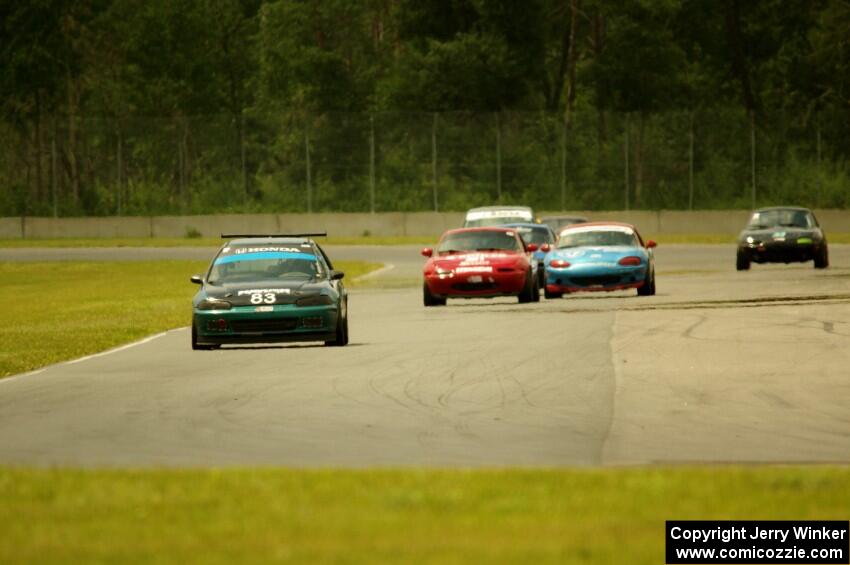 Mark Utecht's STL Honda Civic, along with Andrew Jenkins', Rick Buan's and Gordon Kuhnley's Spec Miata Mazda Miatas