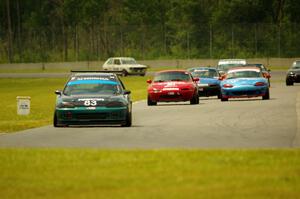 Mark Utecht's STL Honda Civic, along with Andrew Jenkins', Rick Buan's and Gordon Kuhnley's Spec Miata Mazda Miatas