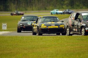 Tom Daly's T4 VW Rabbit, Greg Youngdahl's Spec Miata Mazda Miata and Cody Lindman's STL Mazda Miata