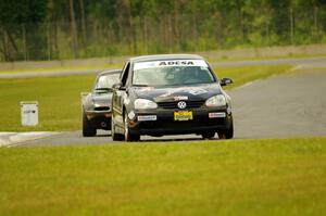 Tom Daly's T4 VW Rabbit and Cody Lindman's STL Mazda Miata