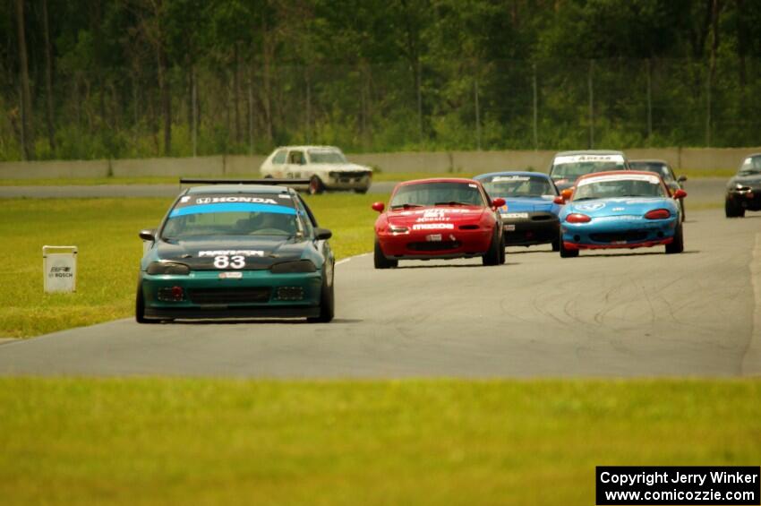 Mark Utecht's STL Honda Civic, along with Andrew Jenkins', Rick Buan's and Gordon Kuhnley's Spec Miata Mazda Miatas
