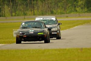 Cody Lindman's STL Mazda Miata and Tom Daly's T4 VW Rabbit