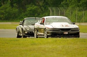 Tom Fuehrer's ITE-1 Ford Mustang and Phil Magney's ITE-1 Porsche 993