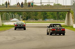 Jessica Johnk's ITJ BMW 325i follows the pace car.