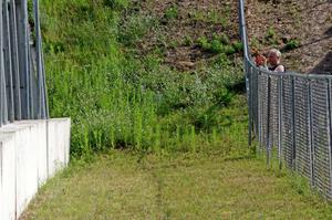 Jon Anderson takes photos from the turn 13 fence.