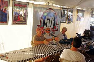 Dick Roe gives his recollections as track owner, as Gary Curtis and Sharon West look on.