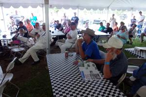 The crowd listens to various speakers give their recollections of the track.