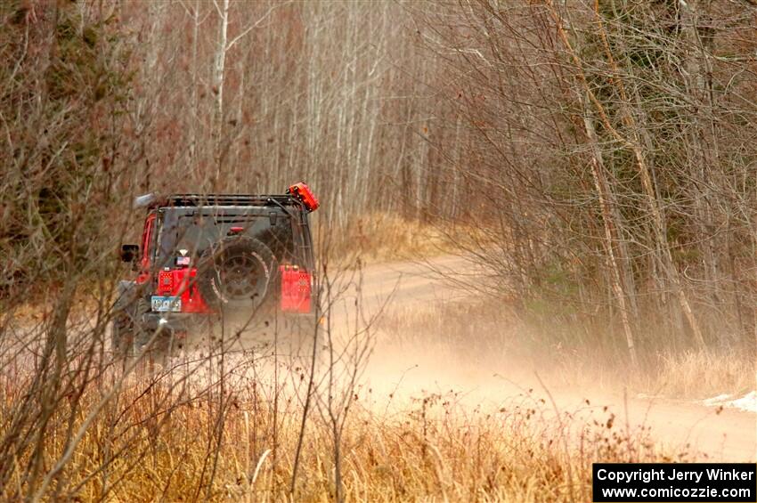 A Jeep Wrangler sweeps SS1.