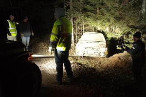 Jordan Locher / Tom Addison Subaru Impreza 2.5RS is pulled from the woods after rolling on SS1.