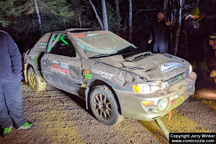 Jordan Locher / Tom Addison Subaru Impreza 2.5RS is pulled from the woods after rolling on SS1.