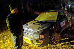 Jordan Locher / Tom Addison Subaru Impreza 2.5RS is pulled from the woods after rolling on SS1.