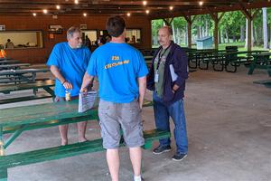 Mark Rokus, Mike Van Alphen and Mark Lietha chat prior to the start of the rally.