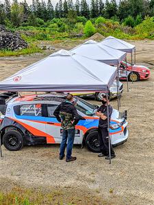 Pat Moro / Ole Holter Chevy Sonic LS heads through tech before the start of the event.