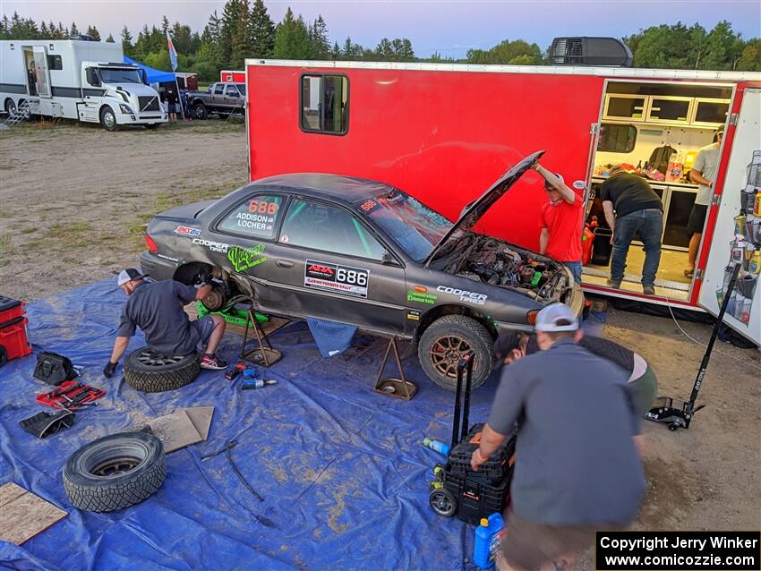 Jordan Locher / Tom Addison Subaru Impreza 2.5RS gets repairs after rolling on day one of the rally.