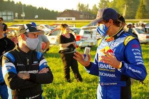 Barry McKenna and Travis Pastrana converse after the event.