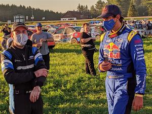 Barry McKenna and Travis Pastrana converse after the event.