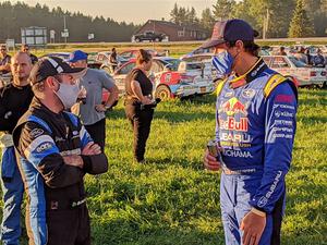 Barry McKenna and Travis Pastrana converse after the event.