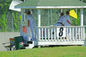 Corner workers at turn 8 notify race traffic of Dave Schaal's stuck car.