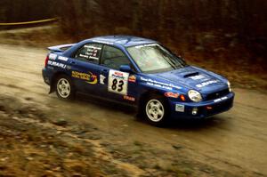 Mark Utecht / Jeff Secor at speed at the crossroads in their Subaru WRX.