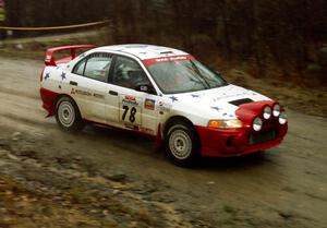 The Paul Dunn / Pete Gossett Mitsubishi Lancer Evo IV comes through the crossroads at speed.