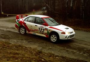 Dennis Martin / John Dillon go past the crossroads spectator location in their Mitsubishi Lancer Evo IV.