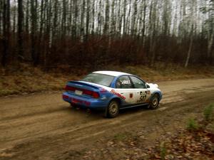 Micah Wiitala / Jane Wiitala at speed on East Steamboat Rd. in their Saturn SL2.