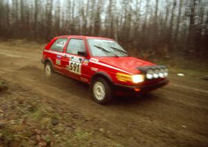 The Dave S. Cizmas / Dave L. Cizmas VW GTI slides through a corner on Steamboat Rd. early in the event.