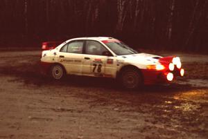 Paul Dunn / Pete Gossett head uphill at the crossroads spectator location in their Mitsubishi Lancer Evo IV.