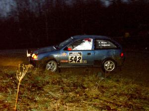 Dan Moore / John Hopponen head uphill at the crossroads spectator hairpin in their Suzuki Swift GTi.