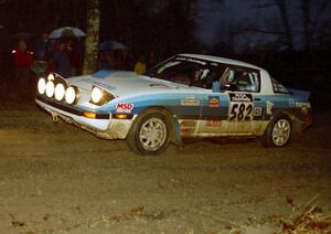 Doug Dill / Tyler Dill head uphill at the crossroads spectator hairpin in their Mazda RX-7.