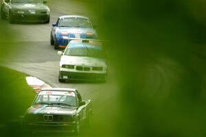 Jessica Johnk's ITJ BMW 325i, Joe Bungert's ITJ BMW 318ti, Geoff Youngdahl's STL Mazda Miata and Sam Nogosek's Spec Miata Mazda