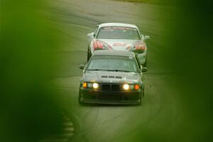 C.J. Harayda's SPU BMW M3 and Justin Elder's STL Mazda Miata